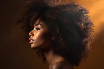 Side view of beautiful black woman with afro hair, soft light photography