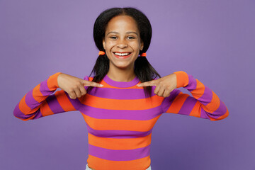 Little satisfied kid teen girl of African American ethnicity 15 years old in striped orange...