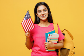 Young smart happy teen Indian girl international student she wear casual clothes backpack bag hold...