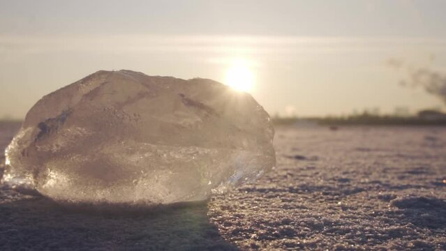 block of ice. frozen river. winter. close-up. sunset.