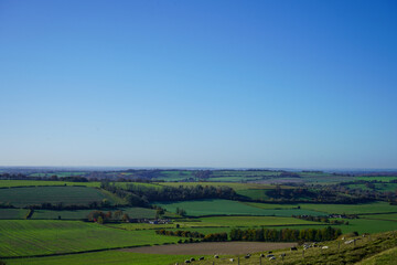 Fototapeta na wymiar View over green countryside and blue skys