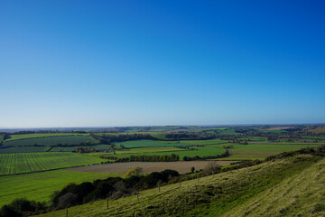 Obraz premium View over green countryside and blue skys