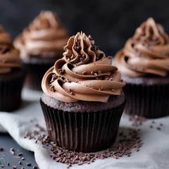 Zelfklevend Fotobehang Delicious chocolate cupcakes with chocolate cream fudge icing and sprinkles © Marko