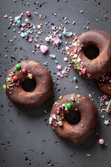 Sweet brownie donuts made of sprinkles and chocolate.