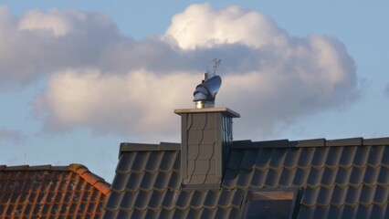 Wind Directional Cowl on Chimney Rotating Gently on Wind