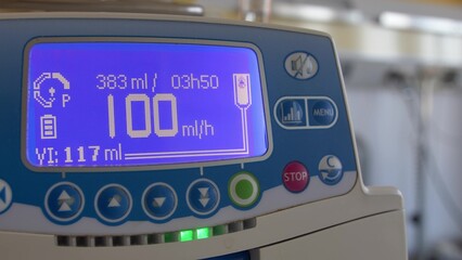 Fluid Drug Dripping via Infusion Pump in Hospital Room