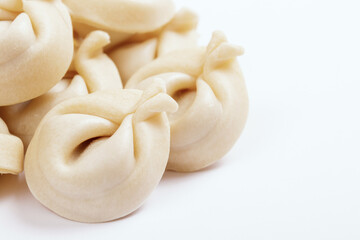  Dumplings on white background closeup. Uncooked dumplings.