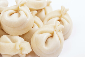  Dumplings on white background closeup. Uncooked dumplings.
