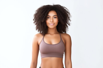Fototapeta premium African American woman showcasing confidence and beauty in fitness attire, with strong curls, against a white backdrop. Generative AI