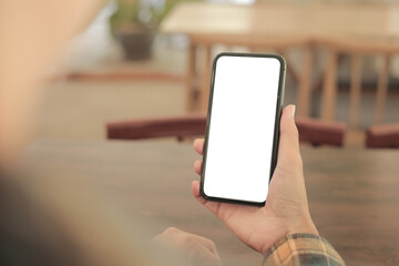 cell phone blank white screen mockup.hand holding texting using mobile on desk at office.background empty space for advertise.work people contact marketing business,technology
