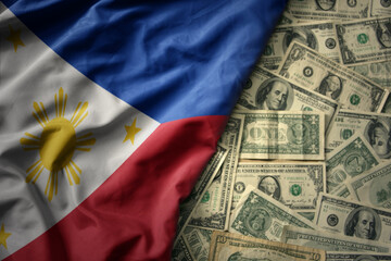 colorful waving national flag of philippines on a american dollar money background. finance concept - obrazy, fototapety, plakaty