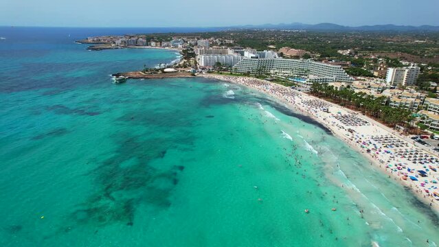 Panoramic aerial view of Sa Coma beach in Mallorca Spain on a summer day