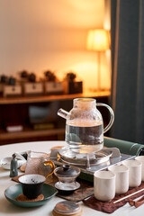 Brewing white tea in a transparent teapot. Everything is ready for the tea ceremony. The ceremony is according to all the rules, but not in the classical style. Adapted to a modern apartment.