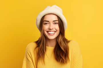 Portrait Of Cheerful Smiling Young Woman Wearing Beanie Hat And Warm Sweater On Copy Space.