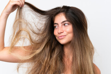 Fototapeta premium Young Pretty caucasian woman isolated on white background with tangled hair. Close up portrait