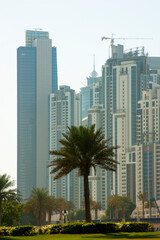 Fototapeta na wymiar DUBAI, UAE - NOVEMBER 13: High rise buildings and streets nov 13. 2012 in Dubai, UAE. Dubai was the fastest developing city in the world between 2002 and 2008.