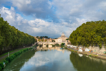 Fototapeta na wymiar St.Peter's basilica viewed across Tiber river in Vatican in Rome. Italy