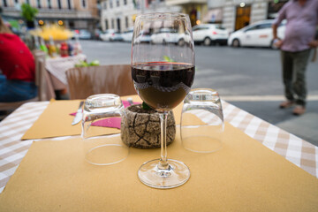 Glass of red wine served in Rome, Italy