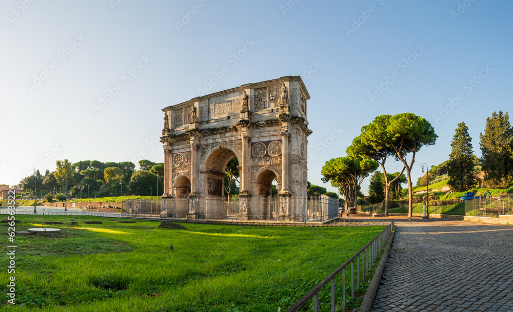 Poster the arch of constantine at sunrise in rome, italy