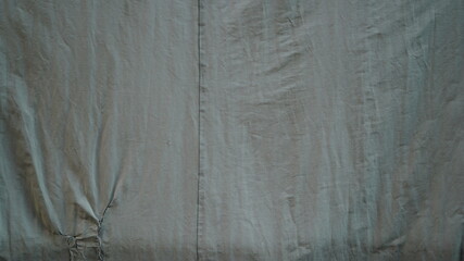 Torn and worn tent texture background
