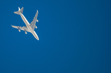 a plane flying in the blue sky