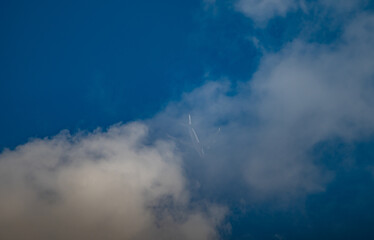 airplane in the sky flying into the cloud