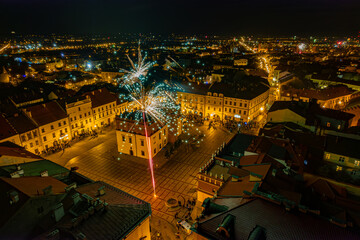 Fireworks at night over town hall in Tarnow