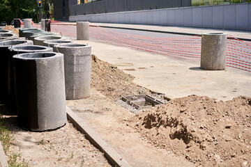 Laying concrete manholes and drain pipes for stormwater system. Connecting a trench drain to a...