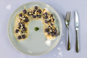 Overhead view of delicious Italian gnocchi with cheese tastefully presented on plate