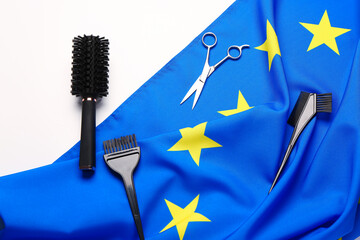 Flag of European Union with hairdresser tools on white background