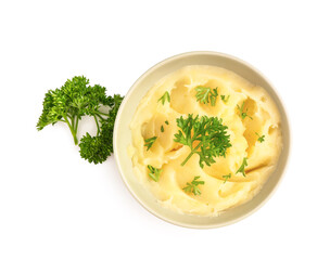 Bowl of tasty mashed potatoes with parsley on white background