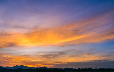 Fototapeta na wymiar sunset sky in the evening over mountains