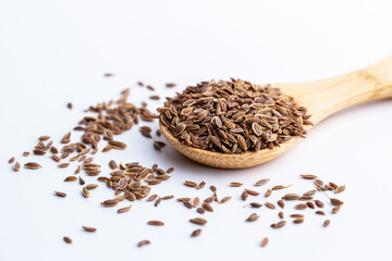 Dill, European Dill ,American Dill (Anethum graveolens  L.) in wooden spoon. Dried herb seeds isolated in white background.