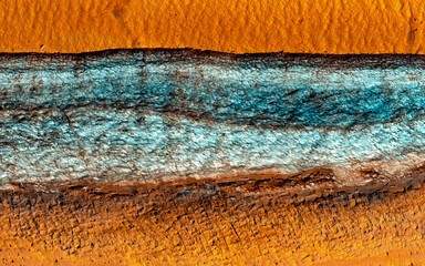 Planet Mars exploration. Cliffs of ice in the mid-latitudes. Color contrast of turquoise and orange. Digital enhancement of an image by NASA