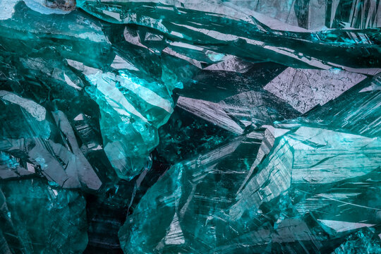 Dioptase crystal macro detail texture background. close-up raw rough unpolished semi-precious gemstone