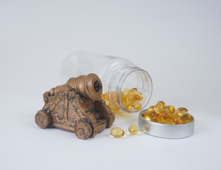 cannon and vitamins in capsules with bottle