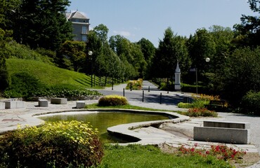 Beautiful spa colonnade with blooming flowers on a summer day, Czech Republic