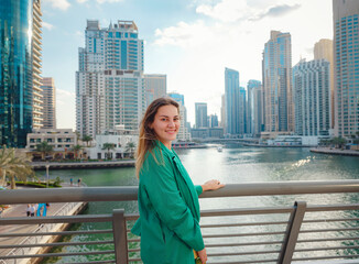 Fototapeta na wymiar woman walks streets of Dubai, Dubai Marina