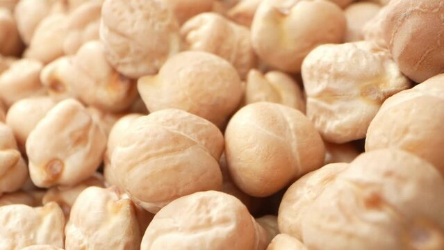 Chickpea seeds, scientifically known as Cicer arietinum, are leguminous seeds that belong to the Fabaceae family. Chickpeas are one of the oldest cultivated crops. Food concept. Chickpea background
