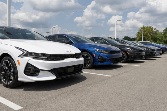 Kia K5 GT-Line display at a dealership. Kia offers the K5 in LX, LXS, EX, and GT models.