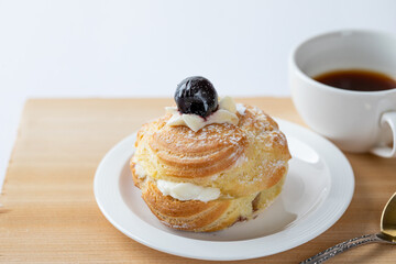 Choux pastry and coffee. . Eclair. Italian pastry. 