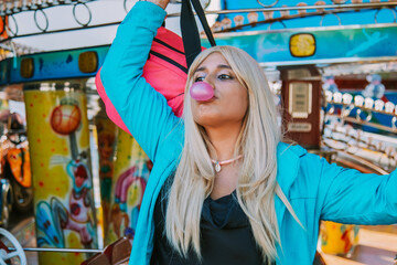 Obraz na płótnie Canvas girl with bubble gum at the party or amusement park