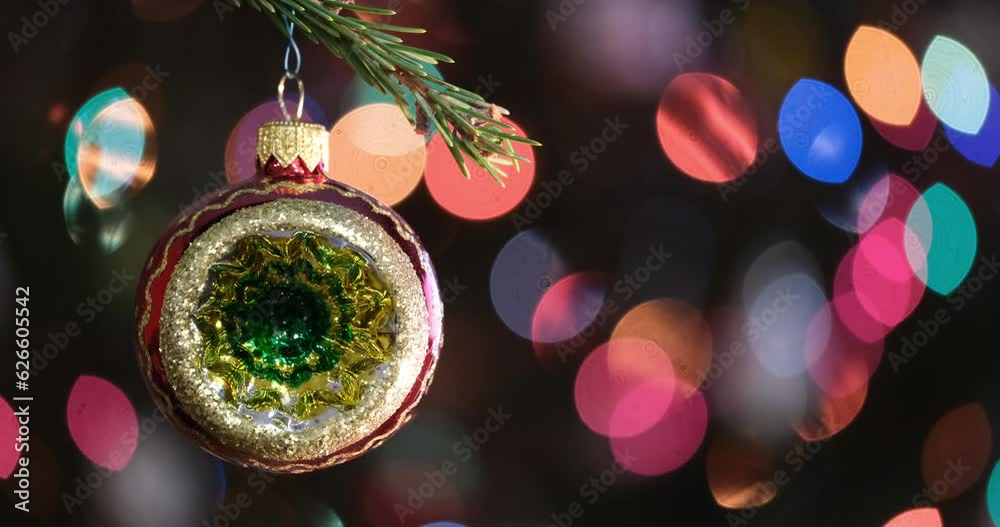 Aufkleber christmas tree decorated red ball toy, fir branch with balls and festive lights on the christmas bac