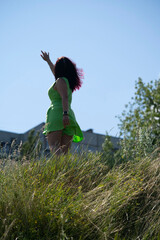 Silhouette of a girl stretching her hand to the sky