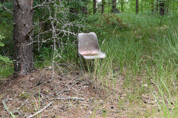 Abandoned chair in the forest