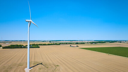 Ohio wind farm in rural remote area with empty dirt fields aerial