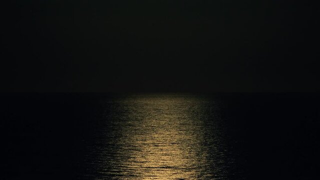 Reflection of moonlight on sea water