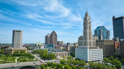 Fotobehang Aerial blue skies over downtown Columbus Ohio with LeVeque Tower aerial © Nicholas J. Klein