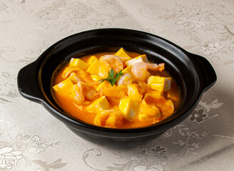 Boiled Tofu with Shrimp and Pumpkin served bowl isolated on background top view of hong kong chinese food