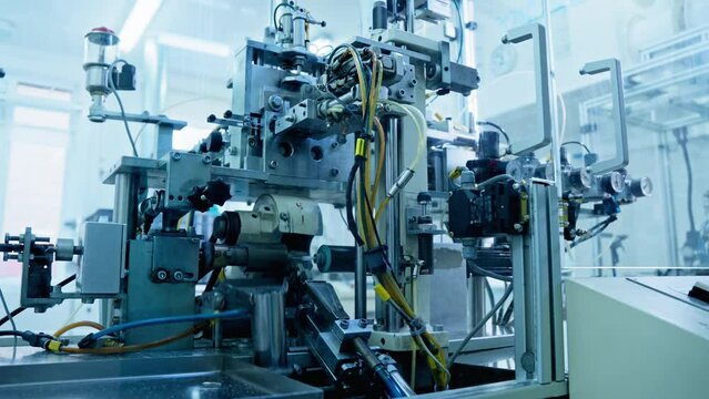 Technology and automation. Factory machine at work. Production equipment at medical industry. Automated line. 4K, UHD